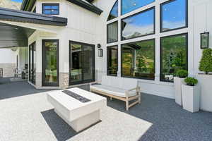 View of patio featuring an outdoor living space with a fire pit