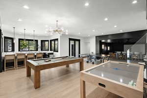 Recreation room with recessed lighting, light wood-type flooring, and billiards table