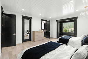Bedroom with recessed lighting, wood ceiling, light wood-type flooring, a chandelier, and access to exterior