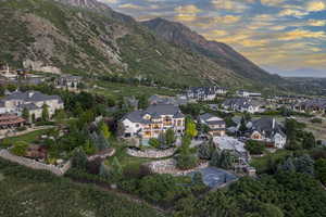 View of property location with a mountain backdrop and nearby suburban area