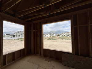 Misc room with a mountain view, a residential view, and plenty of natural light