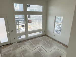 Doorway to outside with baseboards