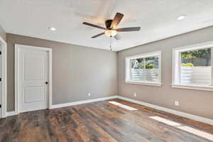 Unfurnished room featuring wood finished floors, ceiling fan, a textured ceiling, and recessed lighting