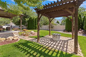 View of yard with a patio and a pergola