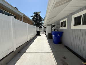 Side yard with newer poured concrete