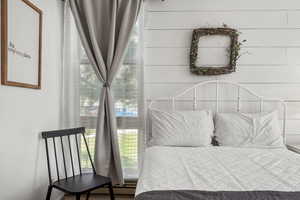 Bedroom with multiple windows