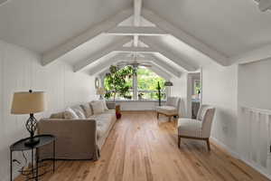Living area featuring light wood finished floors and ceiling fan
