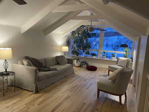 Living area with a ceiling fan and wood finished floors