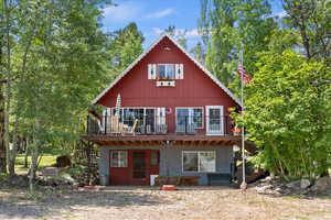 View of front of property featuring a deck