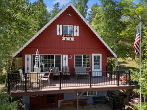 Back of property with a deck