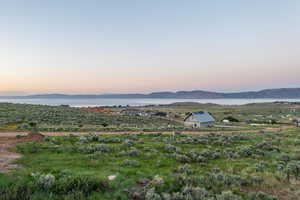 View of mountain backdrop featuring a large body of water