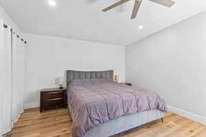 Bedroom featuring wood finished floors, recessed lighting, and ceiling fan
