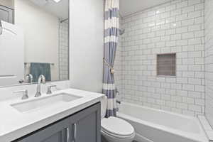 Full bathroom with vanity and shower / bath combo