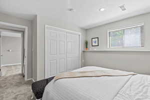 Bedroom featuring carpet floors, a closet, and recessed lighting