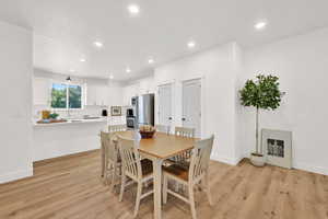 Dining room featuring light wood-style floors and recessed lighting