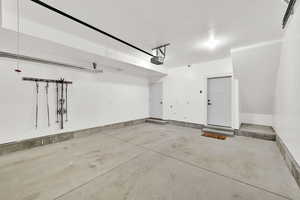 Garage featuring a garage door opener