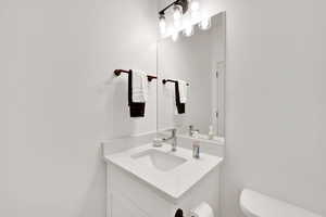 Bathroom featuring vanity and toilet