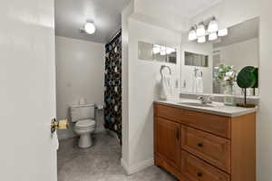 Full bathroom featuring vanity and tile flooring