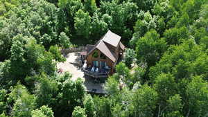 View of subject property with a forest