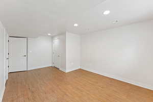 Spare room with recessed lighting and light wood-style flooring