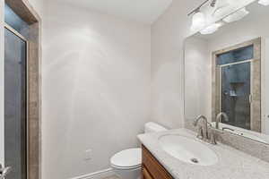 Bathroom with a shower stall and vanity
