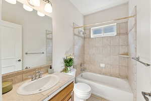 Bathroom featuring vanity and tub / shower combination