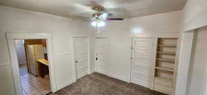 Unfurnished bedroom with ceiling fan