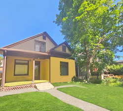 View of front of house with a front yard