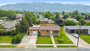 Aerial perspective of suburban area with a mountain backdrop