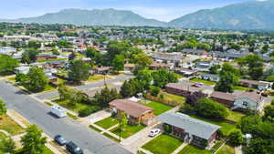 Aerial perspective of suburban area featuring a mountainous background