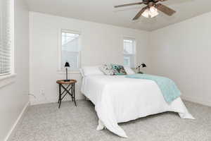 Bedroom featuring carpet flooring and a ceiling fan