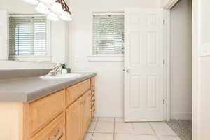 Bathroom featuring vanity and tile patterned floors