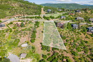 View of property location with a mountain backdrop and property parcel outlined