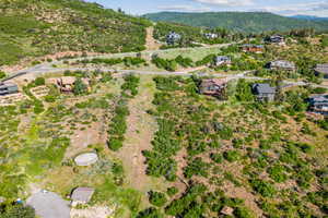 Aerial overview of property's location with a mountainous background
