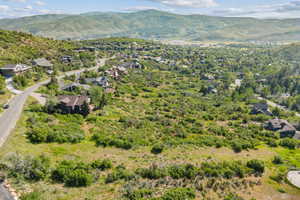 Aerial view of residential area featuring a mountainous background