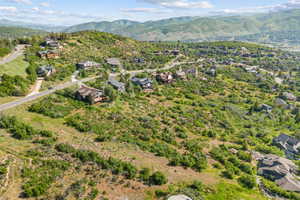 View of property location featuring mountains and nearby suburban area