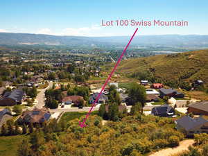 Aerial perspective of suburban area featuring a mountain backdrop