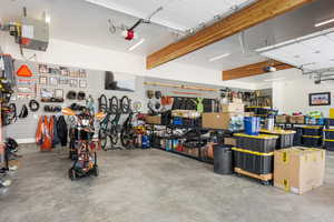 Garage with a garage door opener and a workshop area