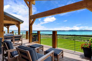 Master deck. Wooden terrace with a water and mountain view