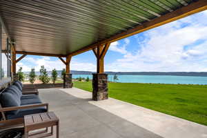 View of patio with a water view