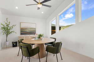 Office area featuring light carpet, a ceiling fan, and recessed lighting
