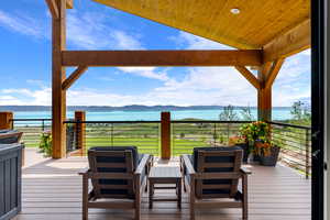 Master Deck. Wooden terrace with a water and mountain view