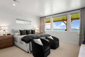 Bedroom with light carpet and recessed lighting