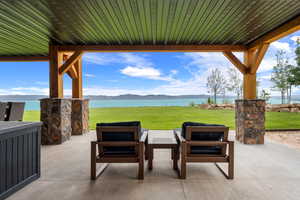 View of patio / terrace with a water view and outdoor lounge area
