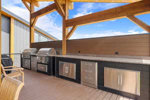 Wooden terrace with exterior kitchen
