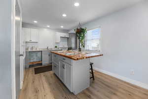 Kitchen featuring center island with butcher block countertop