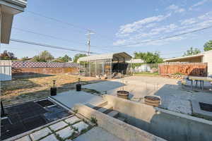 Fenced backyard featuring a patio area