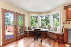 Sunroom / solarium with french doors and healthy amount of natural light