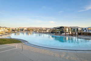 Community pool featuring a residential view and a patio area