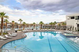 Community pool featuring a patio and a community hot tub
